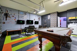 Enjoy  endless game night possibilities in the Star Wars themed game room.