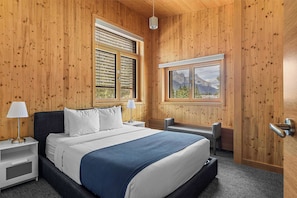 Relax in this luxurious, light filled queen bedroom