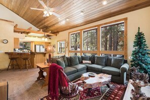 Floor to ceiling windows so you can enjoy view of the surrounding pines.