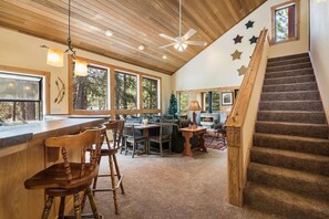 Enter the home into the open concept living, dining, and kitchen. 