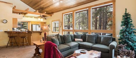 Floor to ceiling windows so you can enjoy view of the surrounding pines.