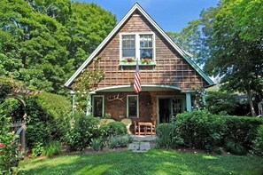 Side view of English garden and covered porch.