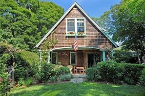 Side view of English garden and covered porch.