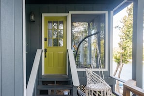 The entrance to the Green Door! With a private chair swing to enjoy the view.