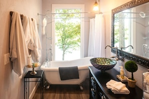Relax with a glass of wine  while in the claw-foot tub. Those views!