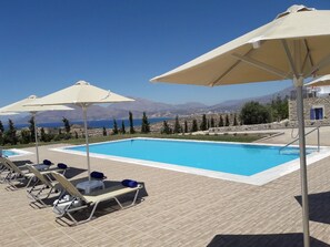 The 82sqm swimming pool with free umbrellas and sunbeds