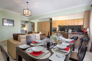 Dinning room table, opposite to the open style American kitchen.