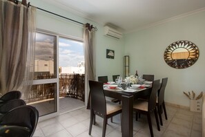 Dining room area looking out to the 7th floor balcony.