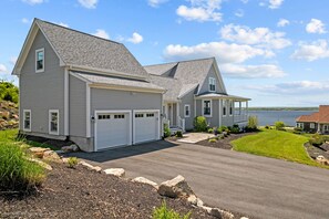 Side view of the home with oversized two care garage.