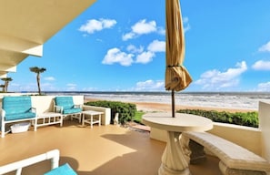 Steps from the beach or sit on this patio for a beach experience w/out the sand