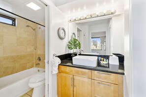 Full bathroom with tub and shower combination