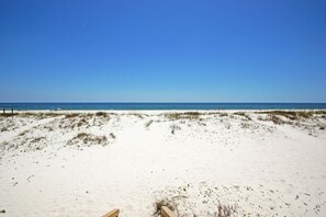 Private beach area in front of the home