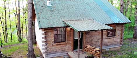 Hidden Ridge Cabin 3, wood stacked for the wood-burning stove or chiminea