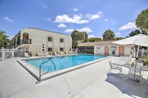 This vacation rental features community amenities such as this outdoor pool!