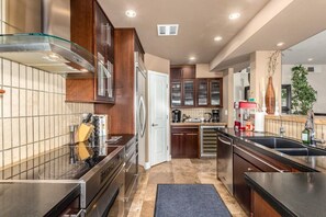 Updated chef's kitchen with Dacor Stove and black marble