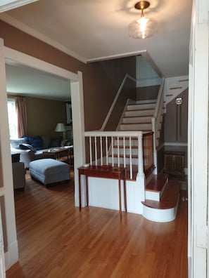 Foyer with entrance to family room and stairway to upper floor