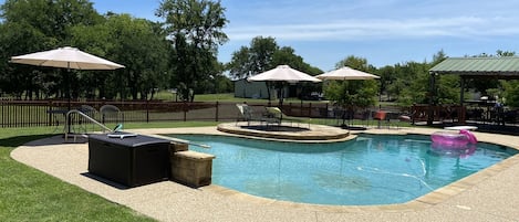 Large swimming pool with diving board and lights 