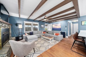 Bright living room with plenty of seating for you and your guests.