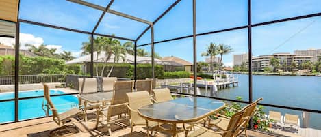 Enjoy outdoor living at The Clam Bay Getaway, using the lanai, pool area or dock