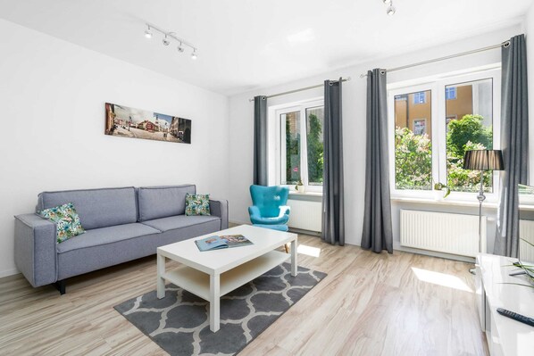 Living room with a comfortable sofa and TV. 