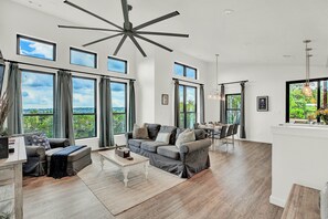 Gather around in this sun-drenched living room for conversation and relaxation.