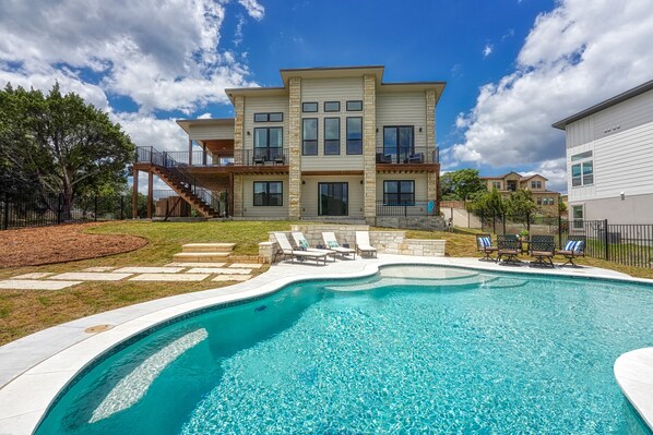 Cool off and relax in the crystal-clear waters of the private pool on a hot summer day.