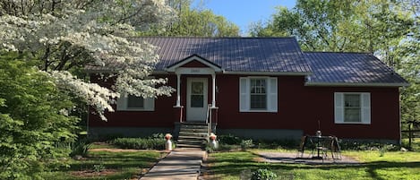 Front entrance in spring. A new metal roof was installed in October of 2018.