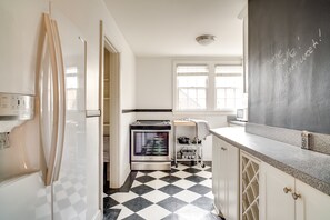 A bright and spacious kitchen for your meal prep - add to our chalkboard too!