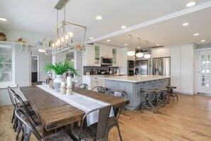 The oversized farmhouse style kitchen is a chefs dream!