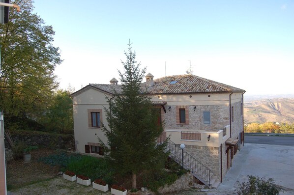 External view of the building. The accommodation, private parking and garden