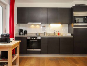 Cabinetry, Countertop, Property, Kitchen Stove, Kitchen, Sink, Kitchen Appliance, Wood, Home Appliance, Interior Design