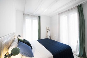 Bedroom with Queen-sized bed and two balconies