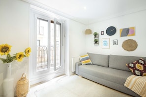 Lounge with double sofa bed, TV and balcony