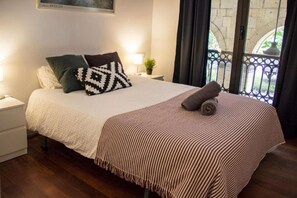 Bedroom with double bed and balcony