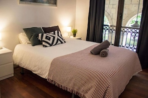 Bedroom with double bed and balcony
