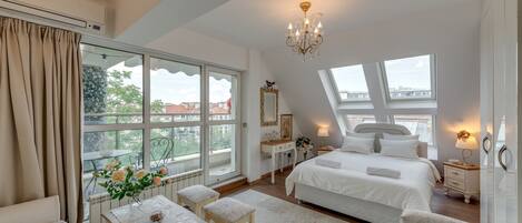 King Size Bed - with beautiful windows above that are closable at night!