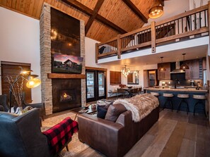 Living area with fireplace and 50 inch smart TV