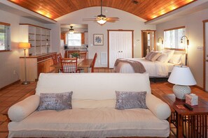 Open floor plan of cabin with Queen sized in living area.