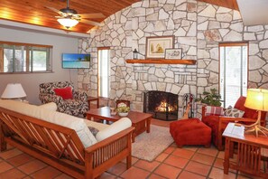 Living room seating and flat screen television.