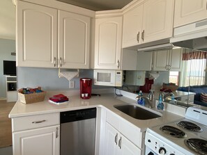 Stove, dishwasher K-cup and plenty of dinnerware/serving utensils