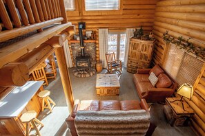 Relax by the fireplace, surrounded by warm lumber and rich hardwood.