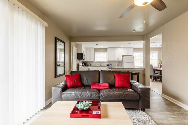 Living room flows into the kitchen and dining area