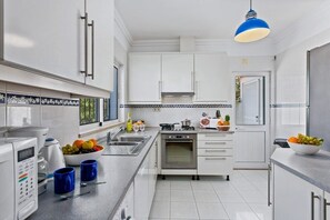 Modern Fully Equipped Kitchen with Washing Machine, Dishwasher, Expresso and Filter Coffee Machines
