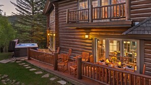 Back patio with hot tub and seating, perfect for warm weather