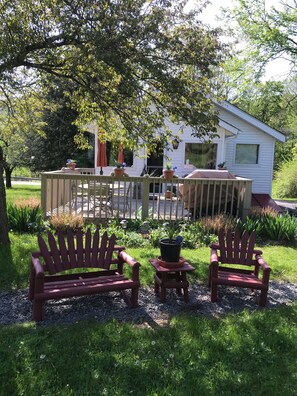 Back of the house with a huge deck facing the organic apple orchard.