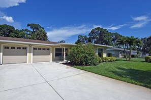 Driveway w/ parking for two cars plus a single garage