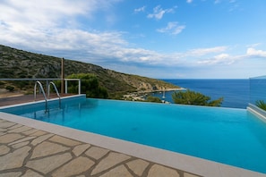 Dive into serenity — the infinity pool offers uninterrupted sea views.