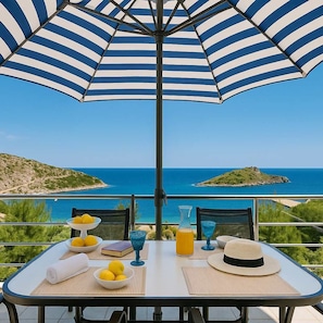 Enjoy coffee on your private balcony as the sea breeze welcomes you to another perfect day in Corfu.