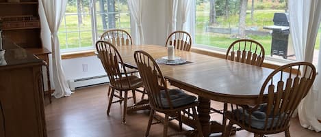 The large dining room table is perfect for family meals and car