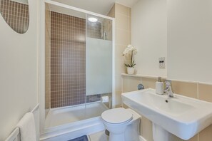The master bedroom features an en-suite shower, complete with complimentary toiletries for your convenience.